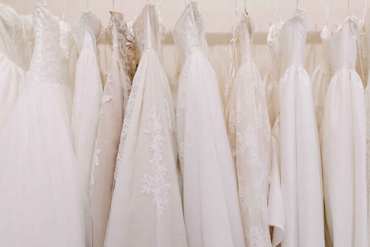 Wedding gowns on a rack in the Brickhouse Bridal showroom