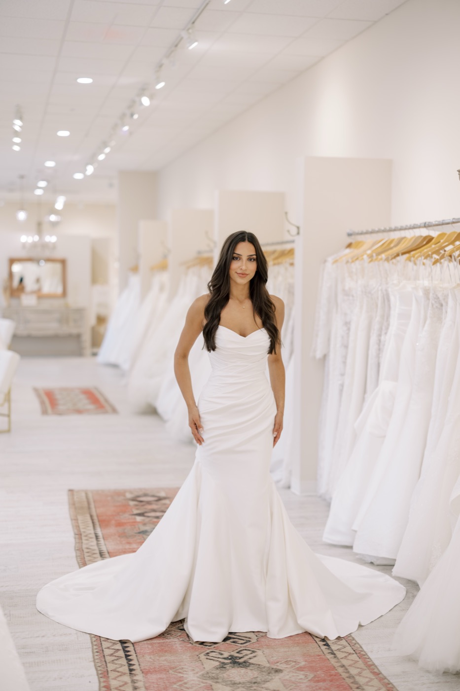 Bride smiling in a fitted wedding gown