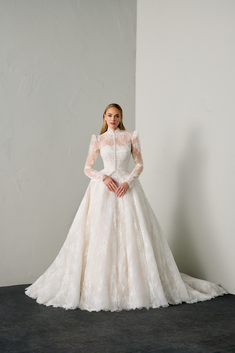 Bride in a Justin Alexander Signature high-neck lace gown with long sleeves