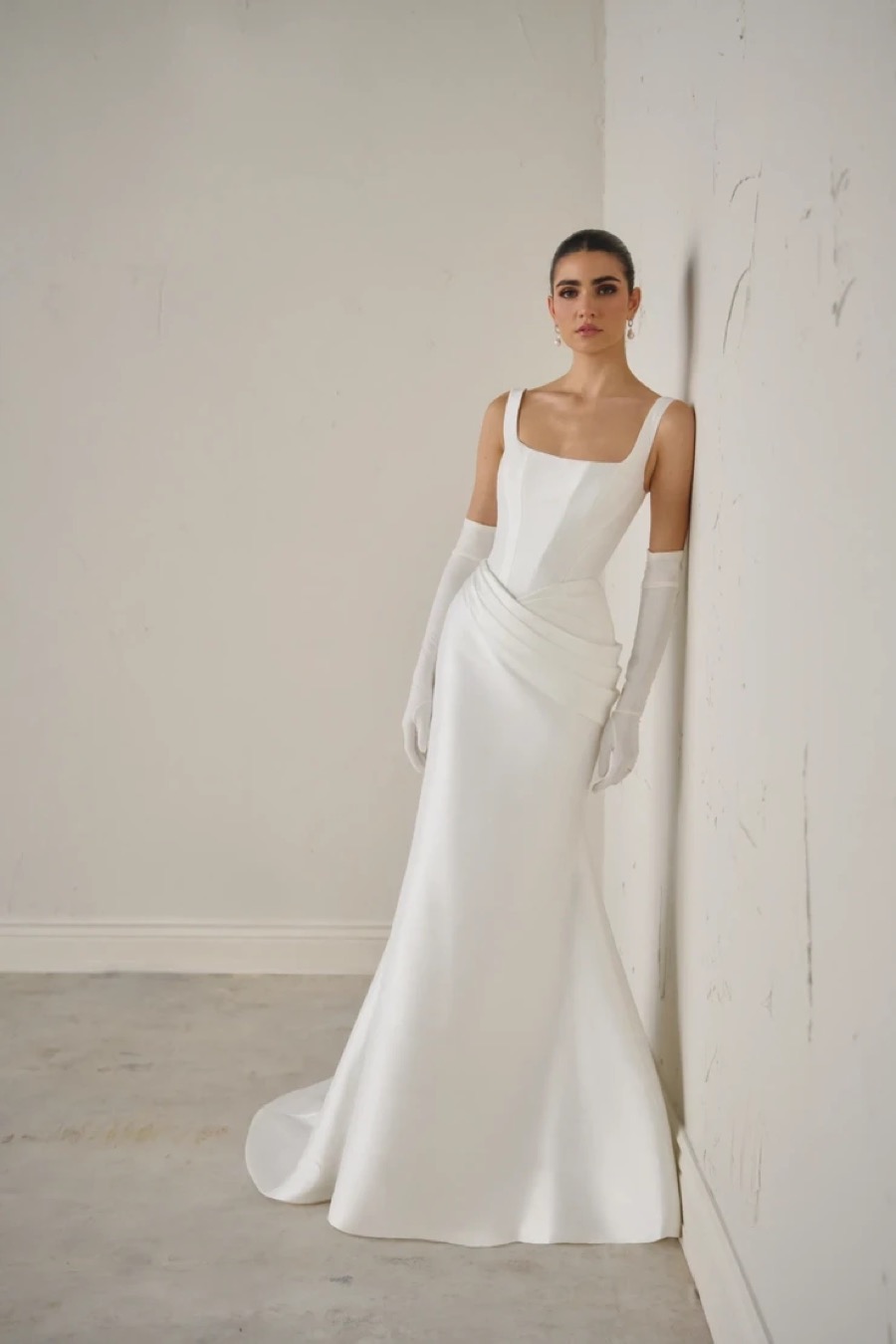 Bride in a Poeza fitted square-neck gown with long gloves