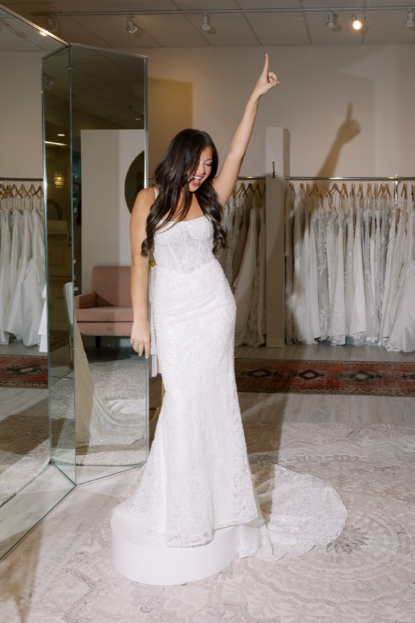 Bride browsing wedding gowns at Brickhouse Bridal